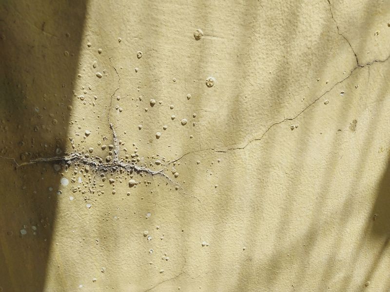 Settlement crack in a stucco exterior wall